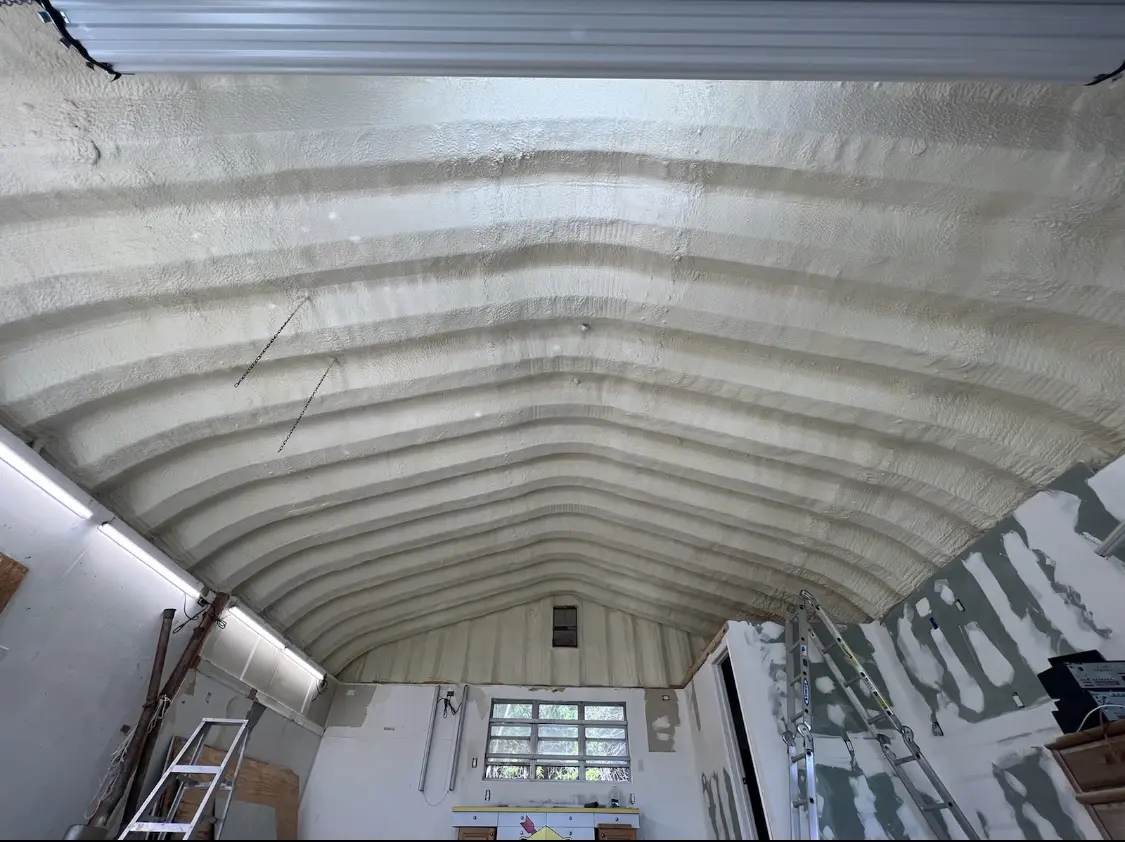 Spray polyurethane foam applied to the underside of a metal roof deck in Rockville